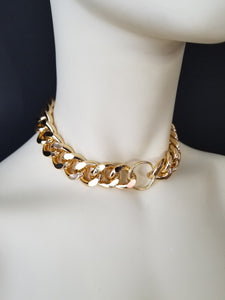 Our original O-RING CHOKER in gold! Stand out in this classic yet versatile chain. The o-ring detail gives it a touch of sexual taboo while still remaining ambiguous to onlookers. Make a statement with our O-RING CHOKER. -Gold color plating-Lead-free chain link-Handmade in Cincinnati.  Men and Women Jewelry FREEWHEELER / CINCINNATI / FASHION / 